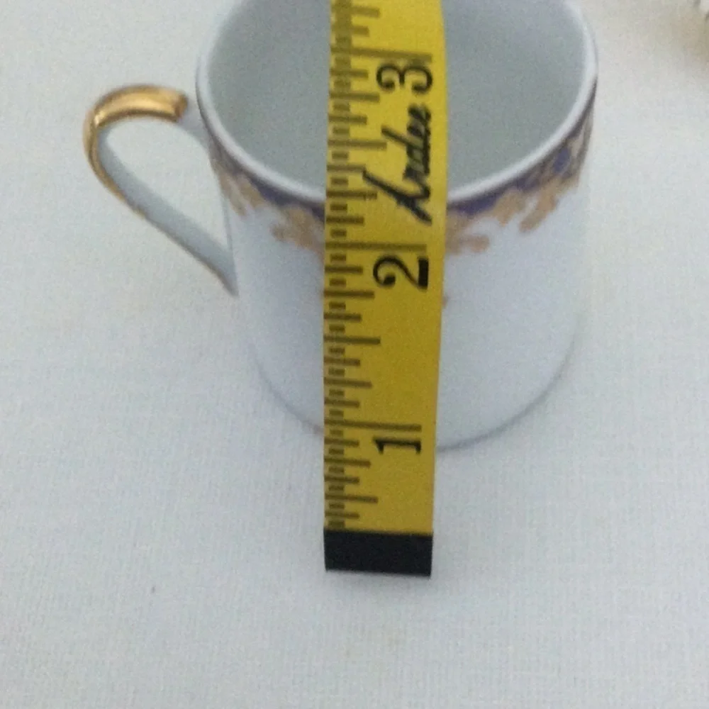 Demitasse Cup and Saucer made in China very pretty design gold white & blue